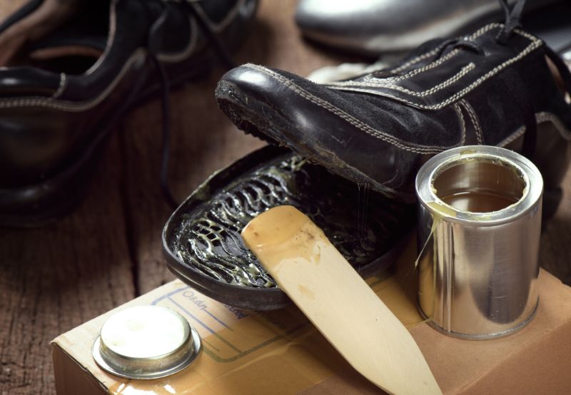 a worn out shoe getting repaired